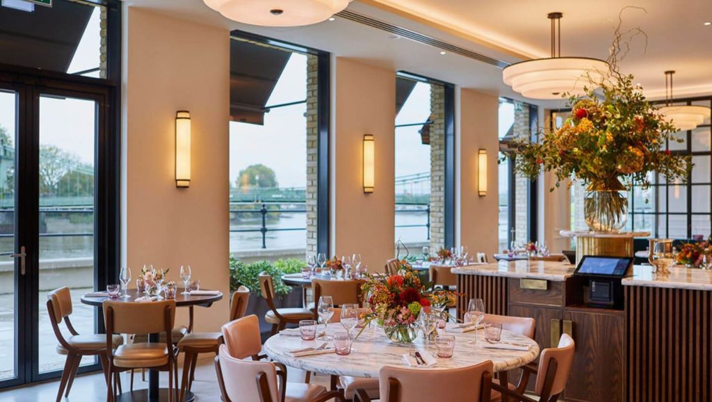Sams Riverside-wide interior view of dining room next to window looking out to River Thames